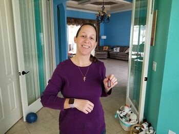 Jodie displays her new Versa on her wrist while showing off the Fitbit One she’ll be sending to RecycleHealth. Click here to read more about Jodie’s Donation.